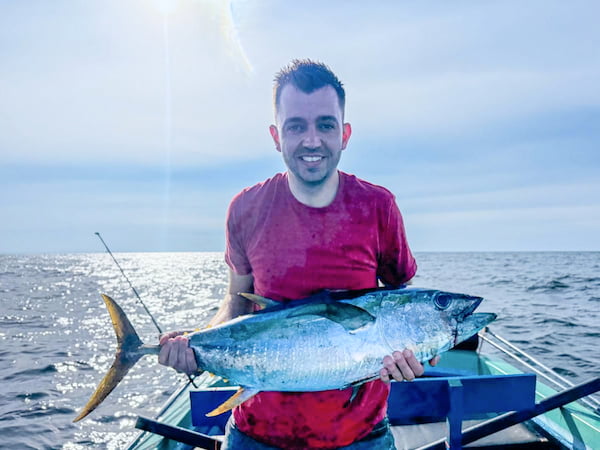 Tourist Holding Fresh Lagoon Catch